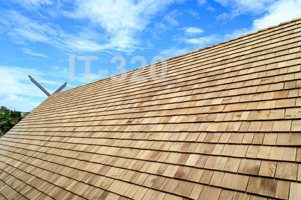 House roof with natural cedar shingles.